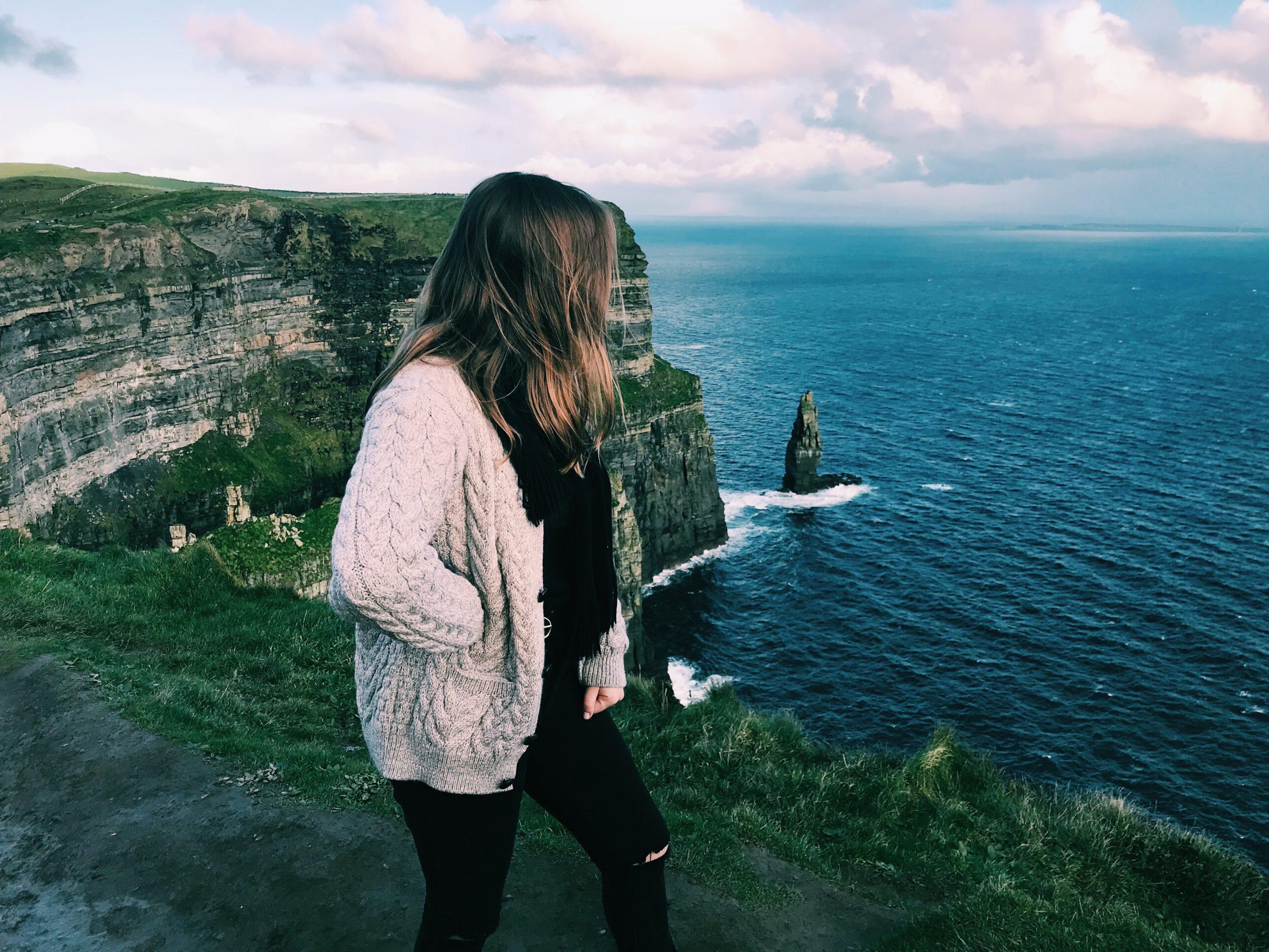 Student standing at the Cliffs of Moher
